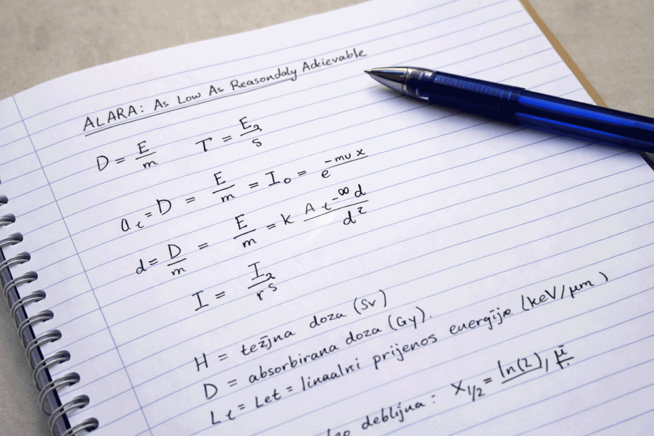 Handwritten radiation protection physics equations in a lined notebook